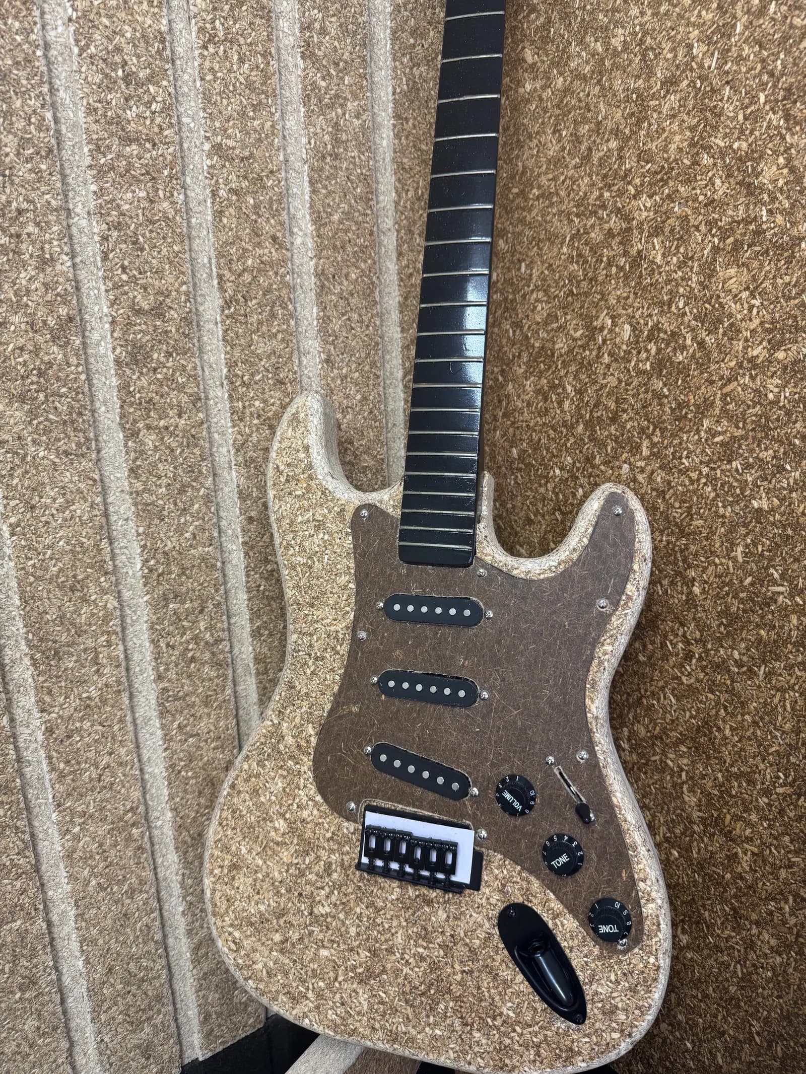 An electric guitar made from hemp board